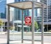 A No Smoking sign at an Australian bus stop, representing common public smoking laws.